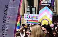 A shot of my placard in this year's pride parade - it reads "ALL THE LETTERS STAND TOGETHER"