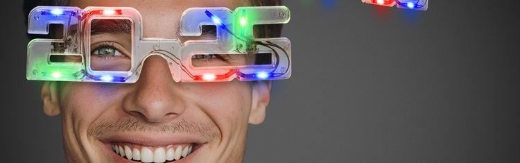 A model wearing a hideous pair of "New Year" LED glasses in the shape of the number 2025.